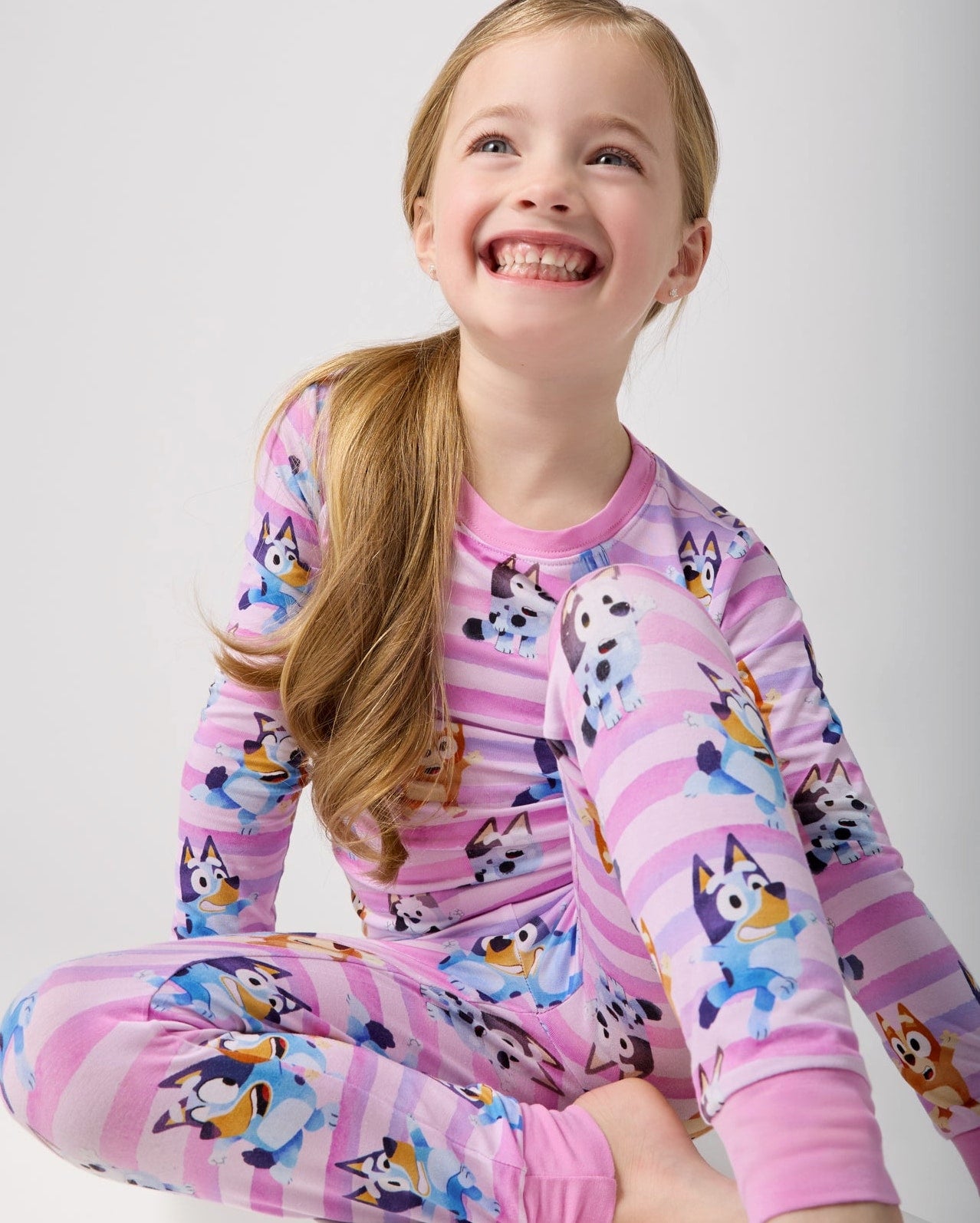 Sitting-girl-wearing-the-Pink-Bluey-Danc